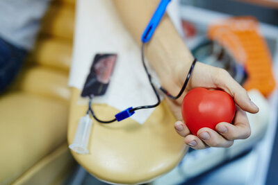 Patient having their blood drawn at a blood drive