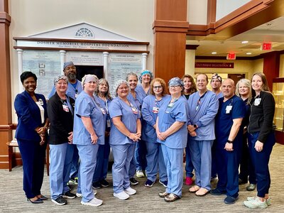 Dosher CEO Lynda Stanley, far left, stands with members of the Dosher Surgical Services and Patient Care teams to celebrate their DNV Hip & Knee Recertification.Dosher CEO Lynda Stanley, far left, stands with members of the Dosher Surgical Services and Patient Care teams to celebrate their DNV Hip & Knee Recertification.