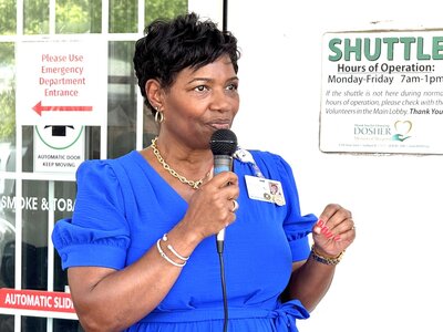 Dosher CEO Lynda Stanley takes the podium at the 2025 Community Cookout.Dosher CEO Lynda Stanley takes the podium at the 2025 Community Cookout.