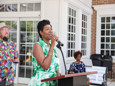 Dosher President and CEO Lynda Stanley (foreground) welcomed guests and expressed gratitude for the community trusting Dosher with their care, with Associate Pastor Justin Wells (left) and Marva Robinson (right).Dosher President and CEO Lynda Stanley (foreground) welcomed guests and expressed gratitude for the community trusting Dosher with their care, with Associate Pastor Justin Wells (left) and Marva Robinson (right).
