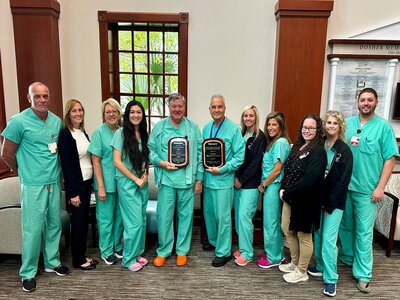 Dosher Wound Care Center Staff from Left to Right: Bryan Norris, RT, HBO Safety Director, Jennifer Zanelotti, BSN, RN, Program Director, Liesl West, BSN, RN, Meredith Dillard, RN, Charge Nurse, Dr. Brad Hilaman, Medical Director, Dr. Robert Zukoski, Katy Ward, FNP, Alicia Scott, RN, Megan Layton, Patient Navigator, Lisa Johnson, BSN, RN, Lucas Hunsucker, BSN, RN, CWON.Photo of the Dosher Wound Care Center Staff from Left to Right: Bryan Norris, RT, HBO Safety Director, Jennifer Zanelotti, BSN, RN, Program Director, Liesl West, BSN, RN, Meredith Dillard, RN, Charge Nurse, Dr. Brad Hilaman, Medical Director, Dr. Robert Zukoski, Katy Ward, FNP, Alicia Scott, RN, Megan Layton, Patient Navigator, Lisa Johnson, BSN, RN, Lucas Hunsucker, BSN, RN, CWON.